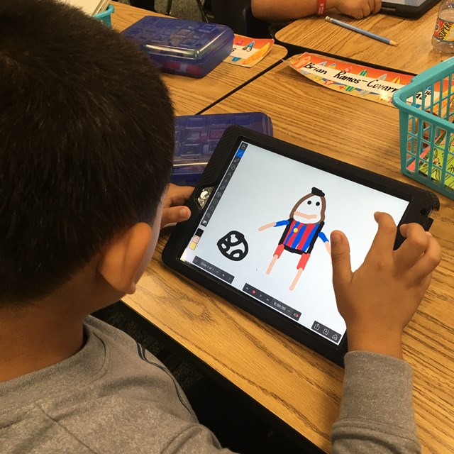 Students use tablets to draw, practice skills, learn reading and writing, and more!