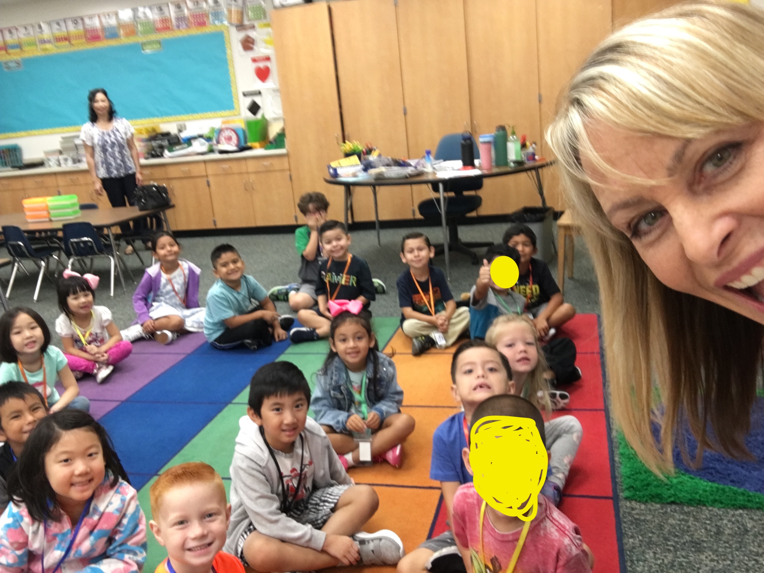 Kindergarteners enjoying their time on the rainbow rug